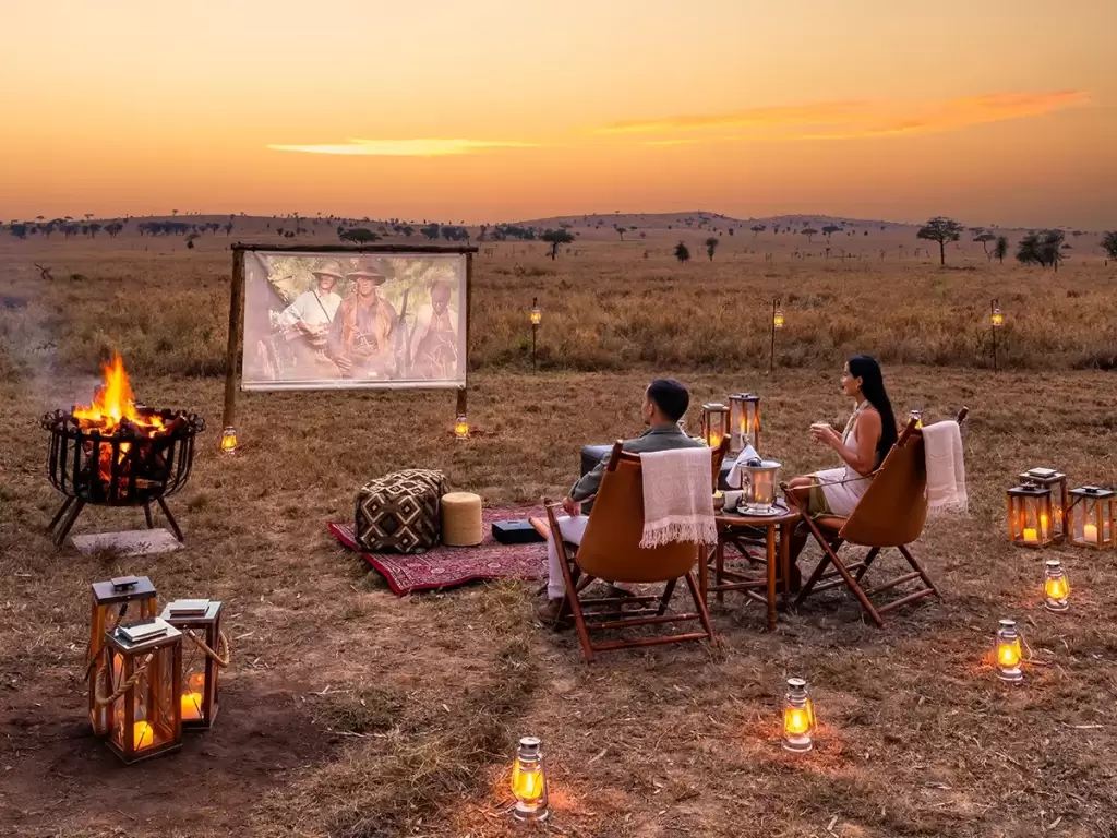 Romantic outdoor cinema under African skies for honeymoon couples seeking luxury and privacy. 