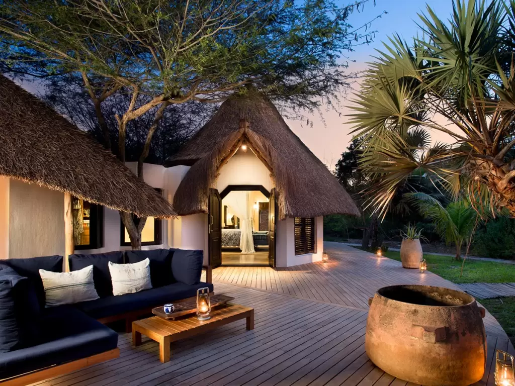 A thatched-roof beach villa on Mozambique’s Benguerra Island at sunset reminds us to reconnect with the soul.
